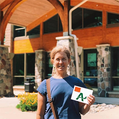 Jennifer outside of Arbor Financial Credit Union location.